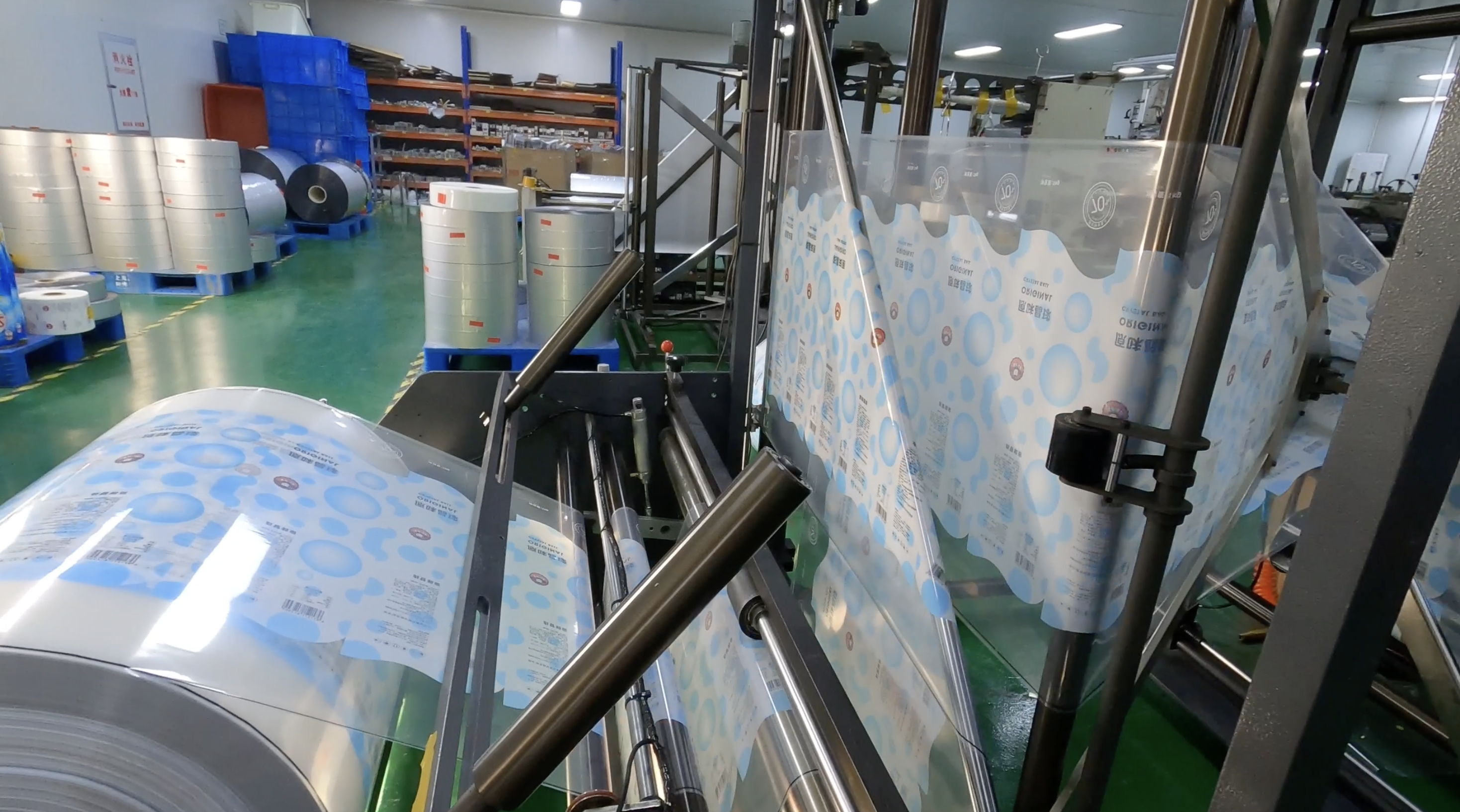 Flexible packaging material moving through the printing process