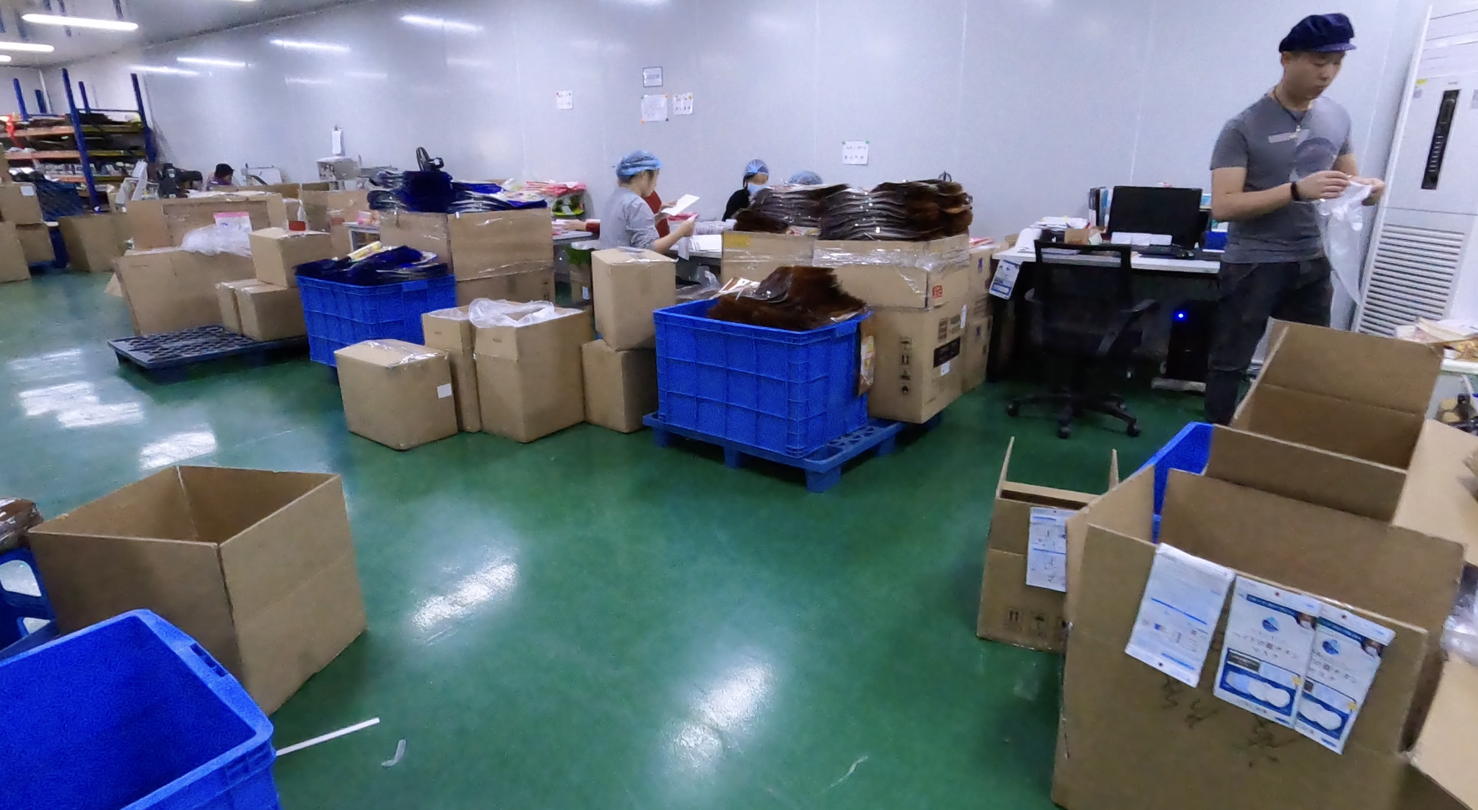 Finished flexible packaging undergoing inspection and packing at BioPouches